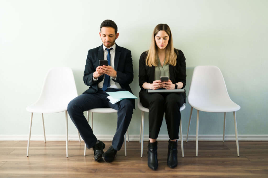 Business colleagues waiting to enter a job interview
